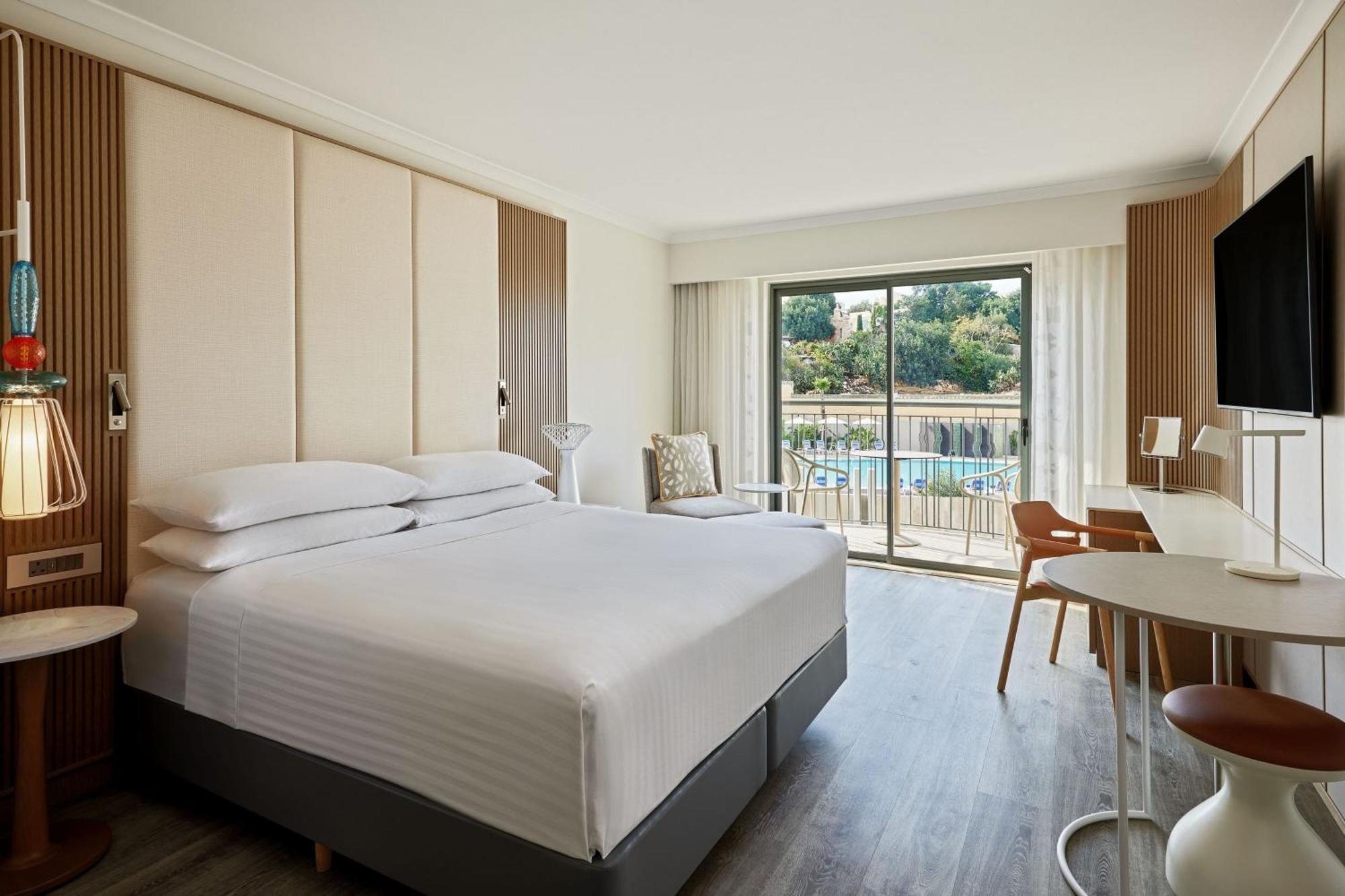 Malta Marriott Resort & Spa Saint Julian's Exterior photo A guest room at the Hilton Athens